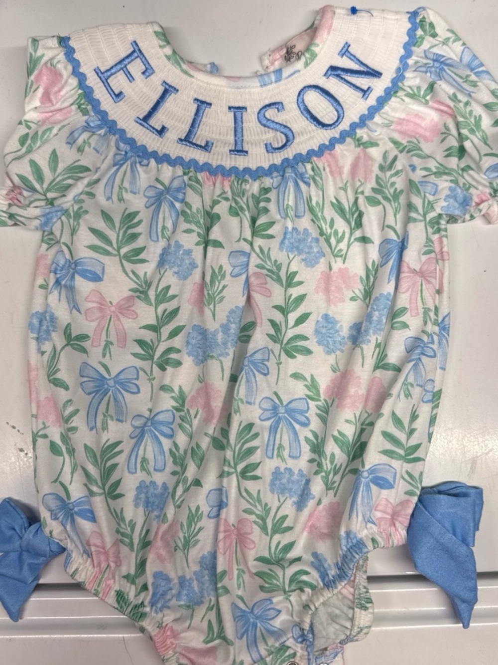Personalized 'ELLISON' Floral Bow Smocked Baby Romper - Pastel Pink & Blue